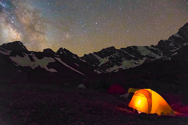 istock Night mountain landscape with illuminated tent 486075248