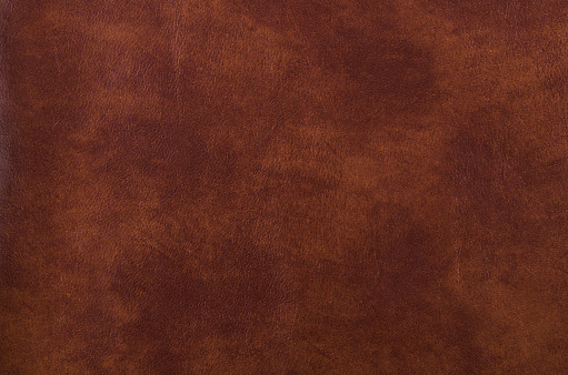 Texture of dark brown leather for decorative background.
