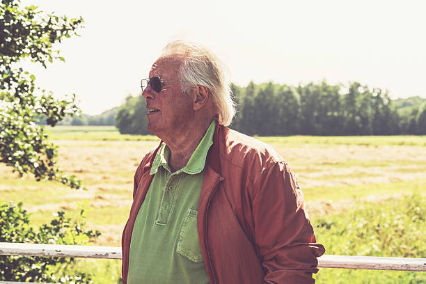 istock Senior Man with Shades Enjoying Summer Nature. 486077366