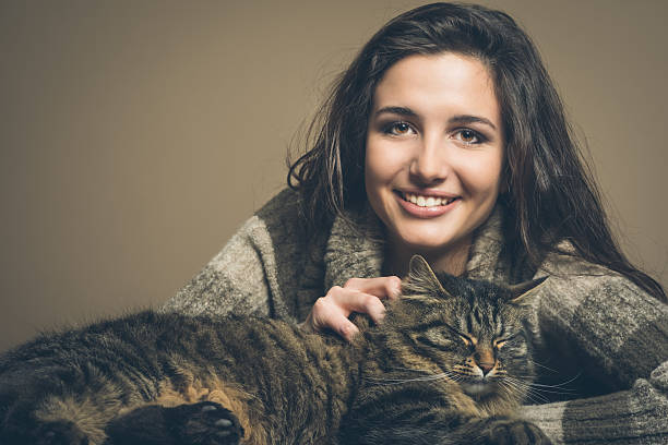 istock Beautiful woman with cat 486077486