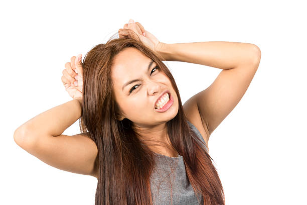 istock Frustrated Asian Girl Temper Tantrum Pulling Hair 486078856