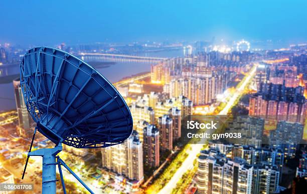 Dish And City Views Stock Photo - Download Image Now - Broadcasting, Communications Tower, 2015