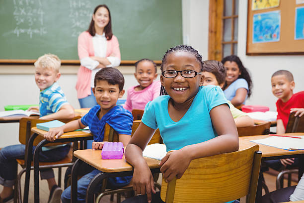 istock Students and teacher looking at the camera 486091044