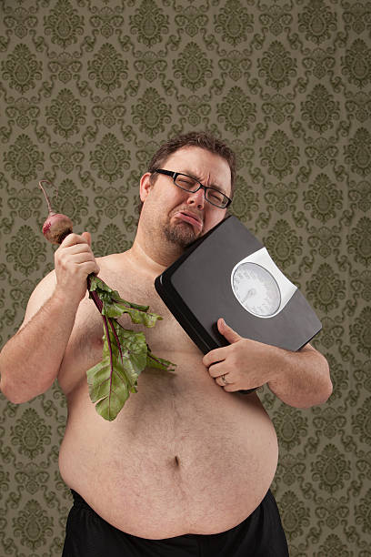 Effettuare scelte sane in sovrappeso uomo - foto stock