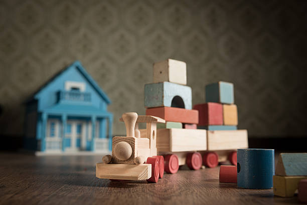 istock Wooden toy train and doll house 486094272
