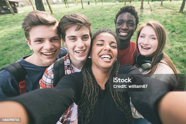 Group Of Multiethnic Teenagers Taking A Selfie Stock Photo - Download Image Now - Adult, African Ethnicity, Beautiful People