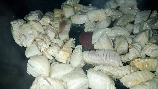istock Chicken cooking in large wok 486098863