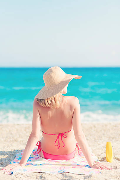 istock Young woman enjoying a sunbath 486100500