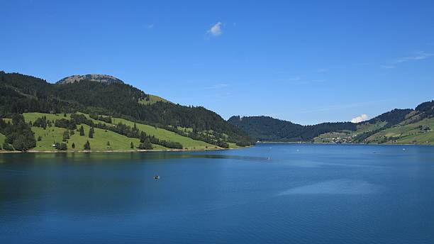 istock Blue lake Waegital and green hills 486100960