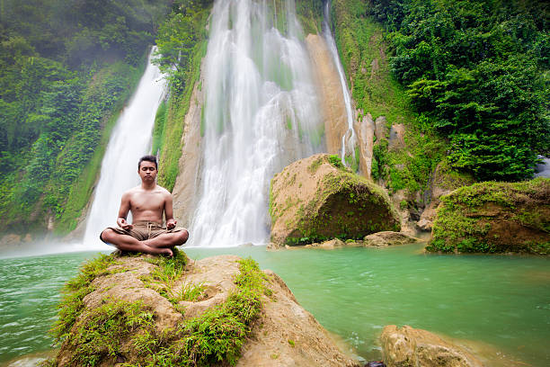istock Meditation in the front of waterfall 486105313