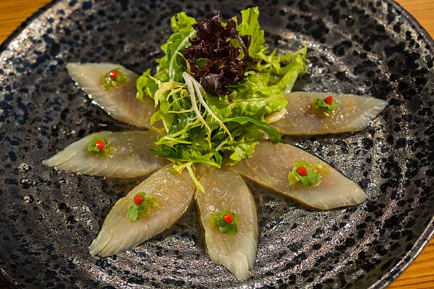 istock Fresh organic white tuna meat sliced at plate with salad 486105611