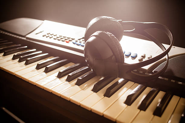 istock Piano keyboard with headphones 486106232