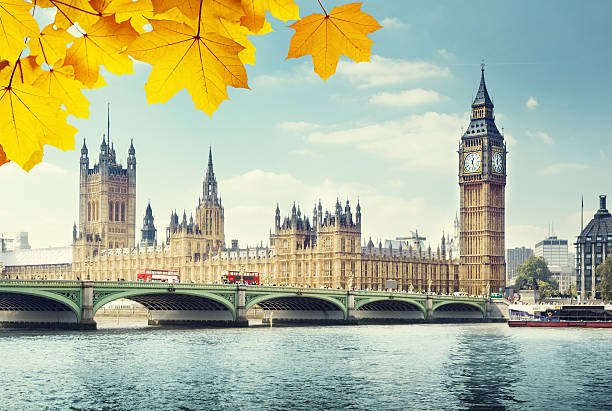 istock autumn leaves and Big Ben, London 486109666