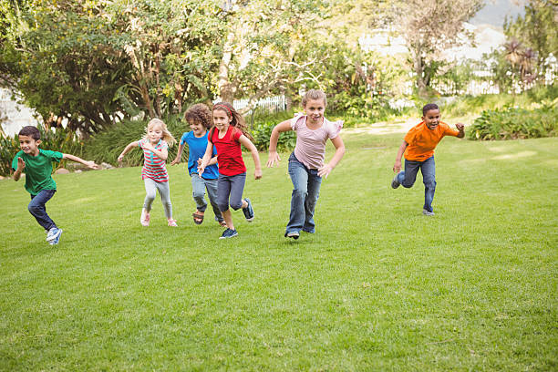 istock Children running on the grass 486109828