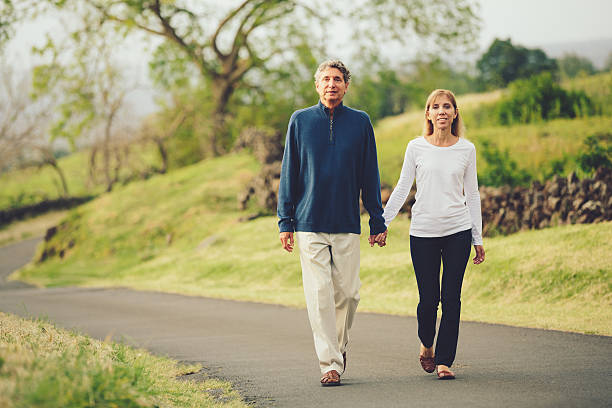 istock Happy loving middle aged couple walking 486110643