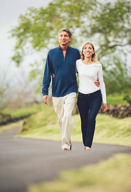 istock Happy loving middle aged couple walking 486110651