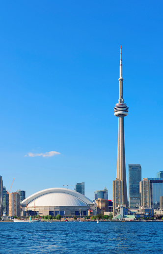 Toronto skyline panorama over lake with urban architecture.