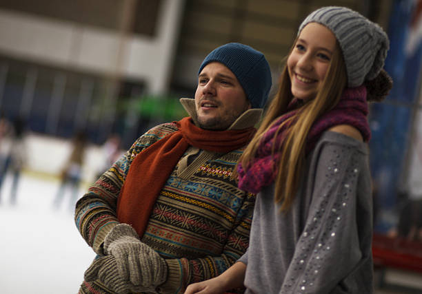 istock Dad and daughter ice skating,indoor 486114575
