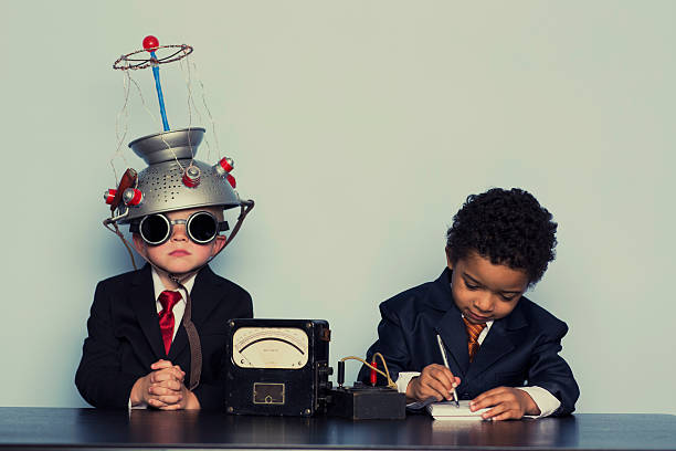 Two Business Boys Maximize Ideas with Mind Helmet It is time to take the business analysis test. How are you doing? nerd kid stock pictures, royalty-free photos & images