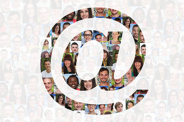 istock At @ sign internet e-mail symbol with group of people 486117550