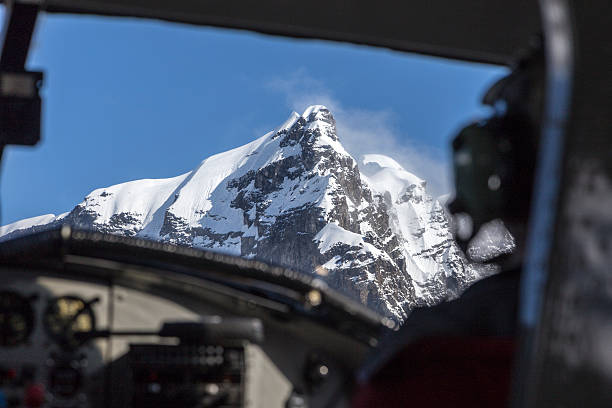 istock Large mountain out of cockpit window 486120313