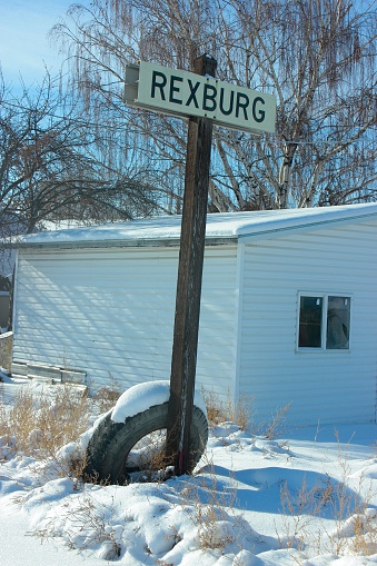 Rexburg sign next to train tracks.