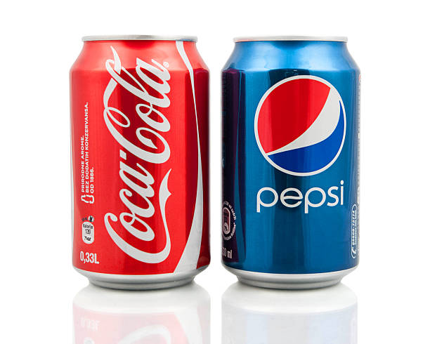 Coca-Cola and Pepsi Kragujevac, Serbia - January 27, 2014: Coca-Cola and Pepsi cans on white background. Symbolic representation of one of the greatest business rivalries of all time. cola photos stock pictures, royalty-free photos & images
