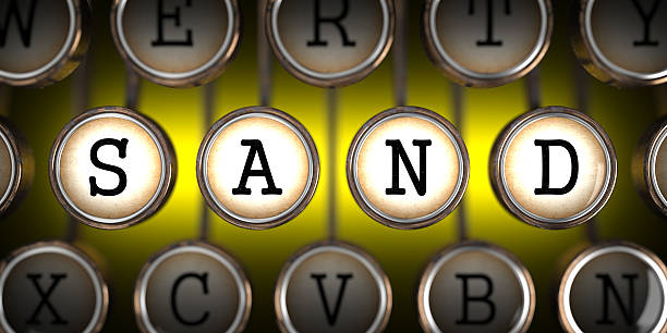 istock Sand - Word on Old Typewriter's Keys. 486121151