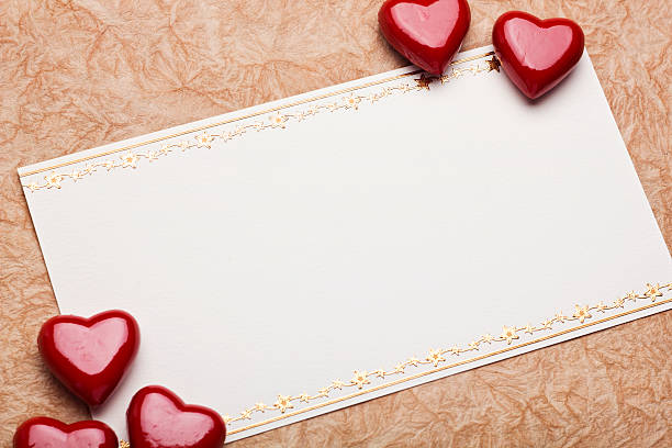istock red hearts on card for text on paper background 486121627
