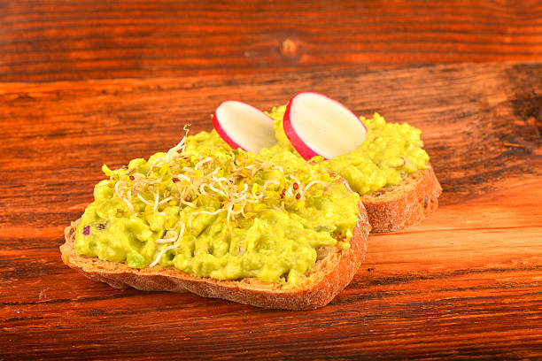 istock Sandwiches with avocado, radish and germs 486125464