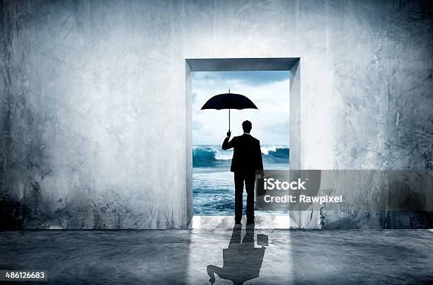 Lonely Businessman Facing Financial Depression Stock Photo - Download Image Now - Uncertainty, Businessman, Umbrella