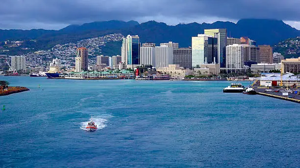 View of downtown Honolulu, Oahu from the deck of a cruise ship as it heads out to sea