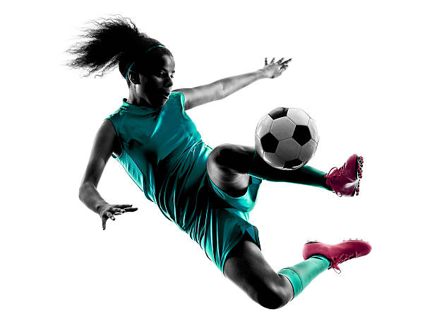 teenager girl child  soccer player isolated silhouette - soccer player stok fotoğraflar ve resimler