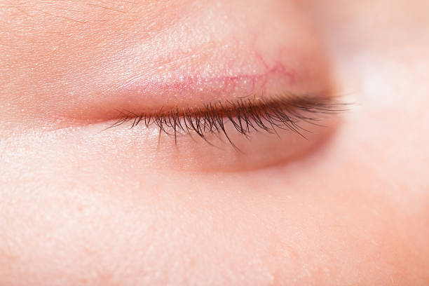 istock Baby's eye closed macro of eyelashes 486129282