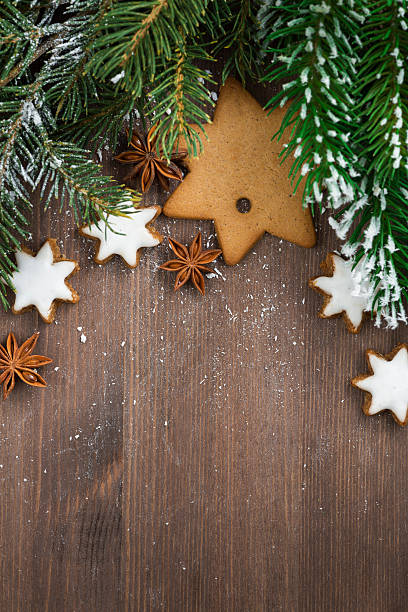istock wooden background with fir branches and cookies, top view 486132202