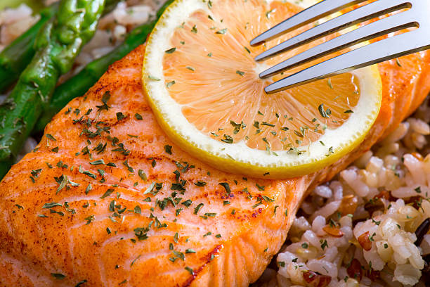 istock Grilled Salmon Dinner over brown rice and wild rice 486132642