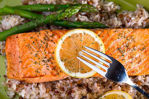 istock Grilled Salmon Dinner over brown rice and wild rice 486132646