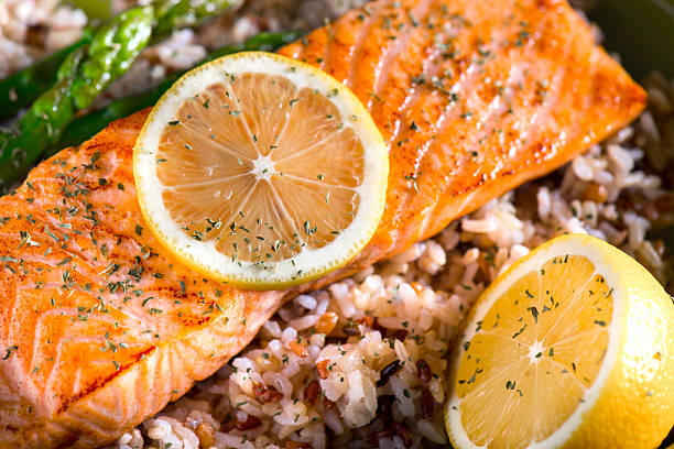 salmone grigliato cena con riso integrale e riso selvatico - herb plant rice white rice foto e immagini stock