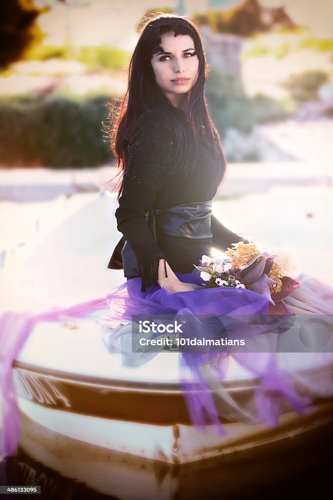 Far away Fashion model looking away  in boat 20-24 Years Stock Photo