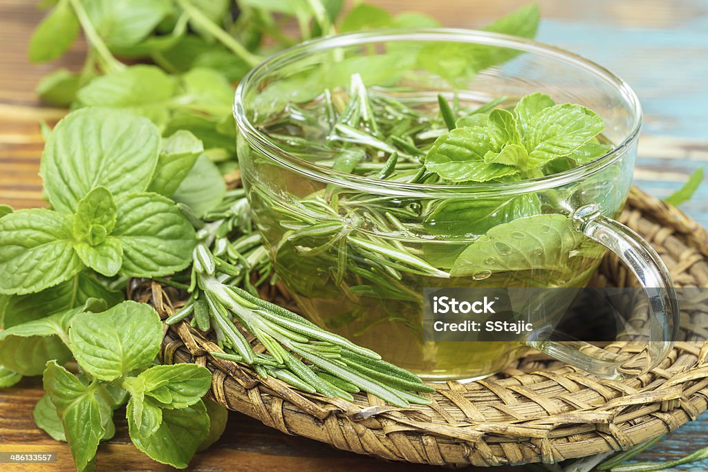 Herbal tea Rosemary Mint Tea with fresh rosemary and mint leaves. Phytotherapy plants and medical herbs Afternoon Tea Stock Photo