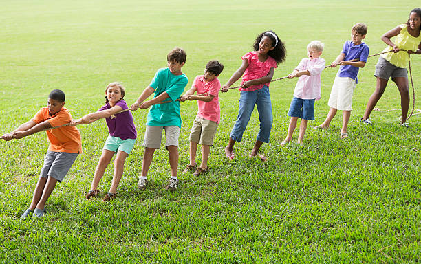 istock Children playing tug of war 486135351