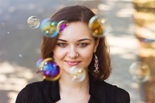 istock Girl and soap bubbles 486136265