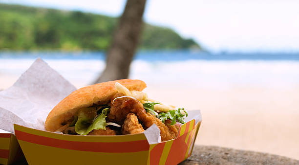 Fried shark and bake food by the beach Maracas Bay Fried shark and bake fast food outdoors by the beach at Maracas Bay in Trinidad and Tobago authentic traditional local Caribbean meal maracas strand stock pictures, royalty-free photos & images
