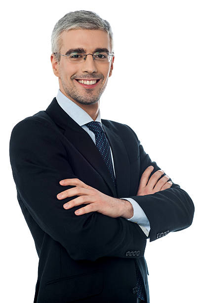 istock Smiling senior businessman with arms crossed 486137877