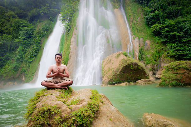 istock Meditation in the front of waterfall 486138641