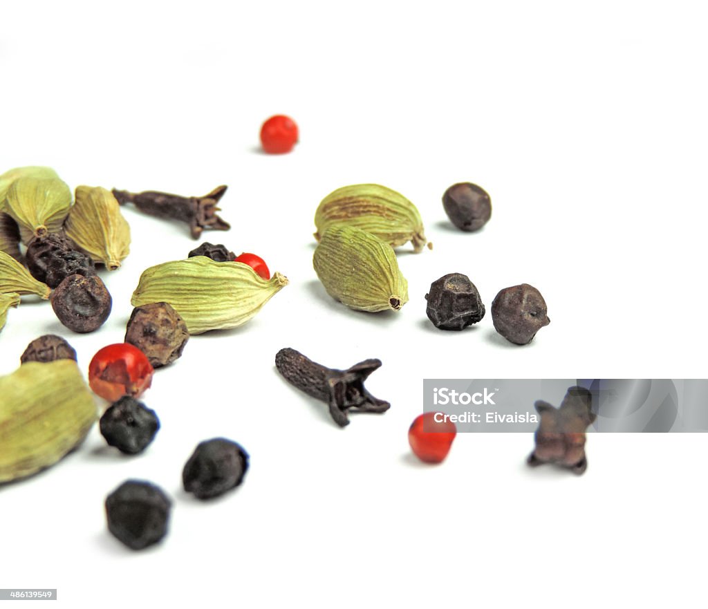 Spices Spices on white. Peppercorns, cardamom and cloves Above Stock Photo