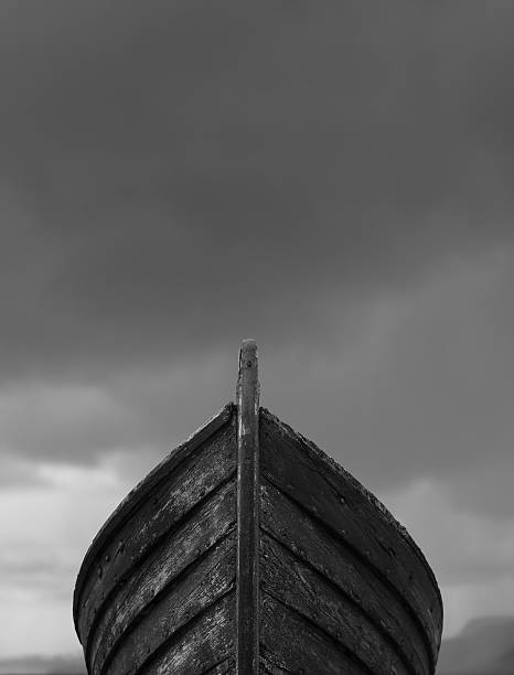 istock Front view of an old fishing boat with clouds 486139616
