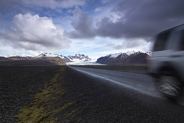 istock Offroad car on a straight road from the mountains 486139620
