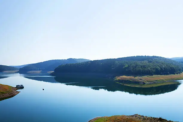 Summertime at lake Biggesee in Sauerland, area of Olpe in North Rhine Westfalia. Middle section of lake,