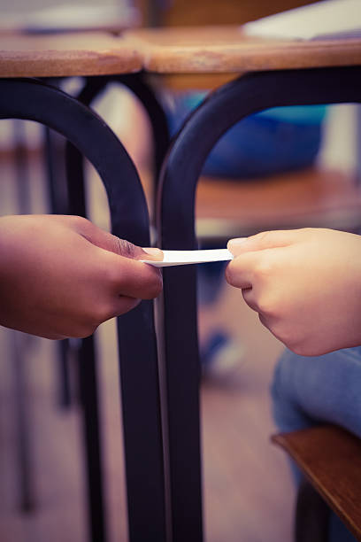 Passing Through Notes 130+ Kids Passing Note In Class Stock Photos, Pictures & Royalty-Free ...